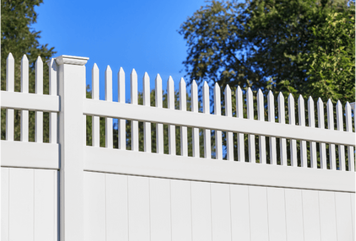 White vinyl fence with spiked picket details along the top